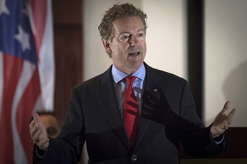 
              In this Aug. 11, 2017 photo, Sen. Rand Paul, R-Ky., speaks to supporters in Hebron, Ky.  The Senate has rejected a bipartisan push for a new war authorization against the Islamic State and other terrorist groups. Senators have decided to let the White House continue using a 16-year-old law as the basis for sending American troops into combat. Senators have voted to scuttle an amendment to the annual defense policy crafted by Sen. Rand Paul that would have allowed the war authorizations created in the wake of the Sept. 11 attacks to lapse after six months.   (AP Photo/Bryan Woolston)
            