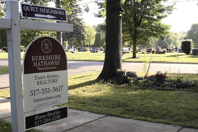 
              This Sept. 8, 2017 photo provided by Shane Broyles shows a real estate sign in the yard of a home in Dewitt, Mich., that markets the fact that the dwelling, across the street from a cemetery, has quiet neighbors. Broyles the real estate agent who added the message to the sign said that he hadn't previously used humor to market a house. But he says "there's not much point to life" without some fun. (Shane Broyles photo via AP)
            