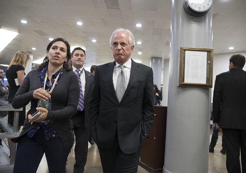 Senate Foreign Relations Committee Chairman Bob Corker, R-Tenn., center, speaks with a reporter as he heads to the Senate for a weekly GOP conference luncheon at the Capitol in Washington, Wednesday, Sept. 6, 2017. (AP Photo/J. Scott Applewhite)
