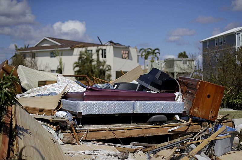 
              A bed sits amongst the remains of its room in a home demolished from Hurricane Irma in Goodland, Fla., Tuesday, Sept. 12, 2017. (AP Photo/David Goldman)
            