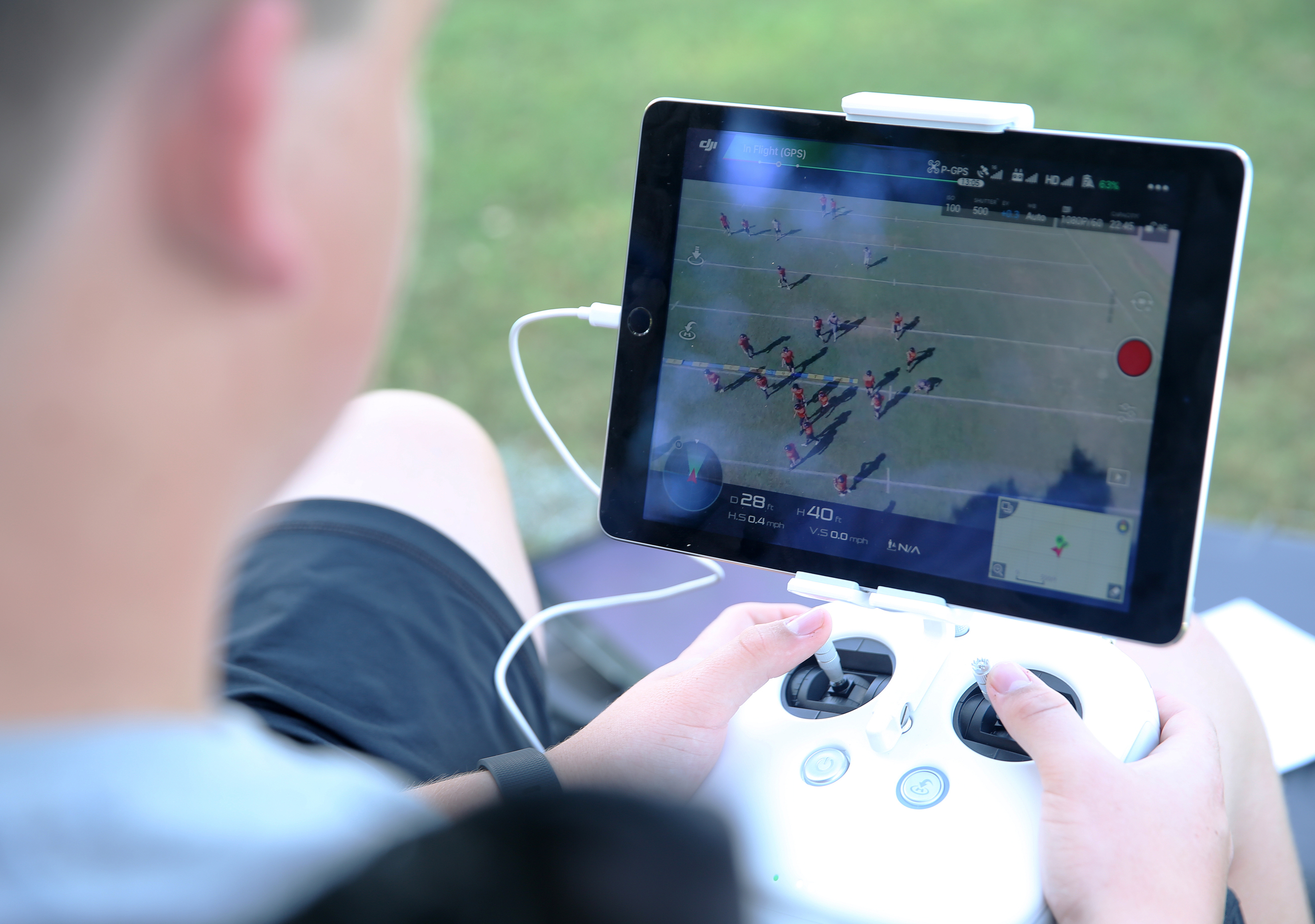 Devin Parker navigates a drone over football players to get footage for coaches Tuesday, Aug. 29, 2017, at South Pittsburg High School in South Pittsburg, Tenn. The video captured from the drone allows coaches to determine what players are doing wrong and how to fix mistakes.