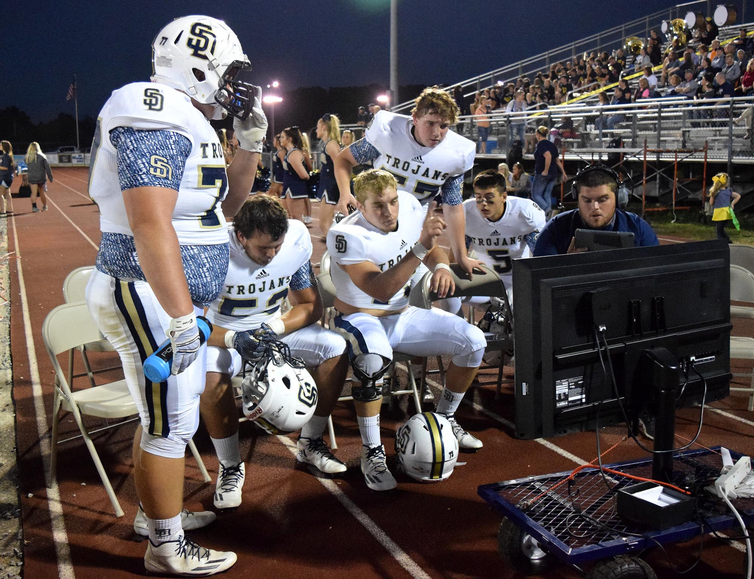 The Soddy-Daisy offensive line reviews plays between series. The Soddy-Daisy Trojans visited the Walker Valley Mustangs in TSSAA football action on October 6, 2016