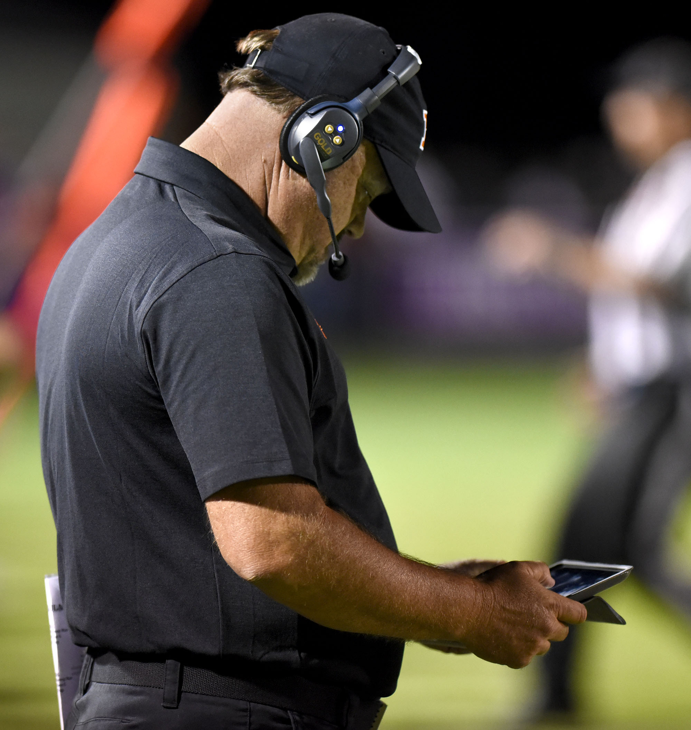 South Pittsburg head coach Vic Grider studies video on a ipad. The South Pittsburg Pirates visited the Marion County Warriors in TSSAA football action of September 8, 2017.