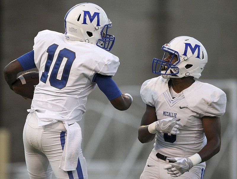 McCallie quarterback Deangelo Hardy (10) and teammate Shannon Walker celebrate Hardy's touchdown during the Best of Preps Kickoff Classic jamboree last month at Finley Stadium. McCallie hosts Ensworth tonight.