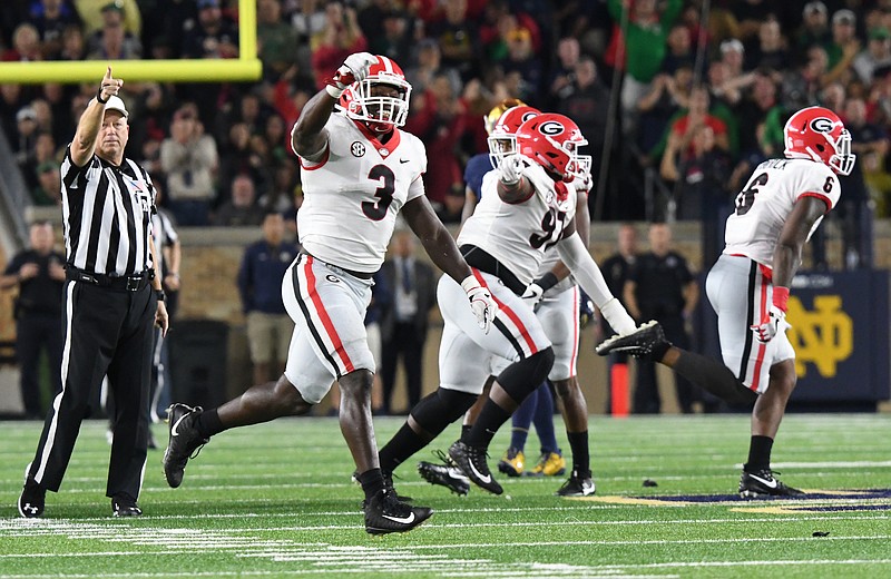 Georgia junior inside linebacker Roquan Smith (3) celebrates after Lorenzo Carter recovers the fumble caused by Davin Bellamy in the final 90 seconds of last Saturday night's 20-19 win at Notre Dame.