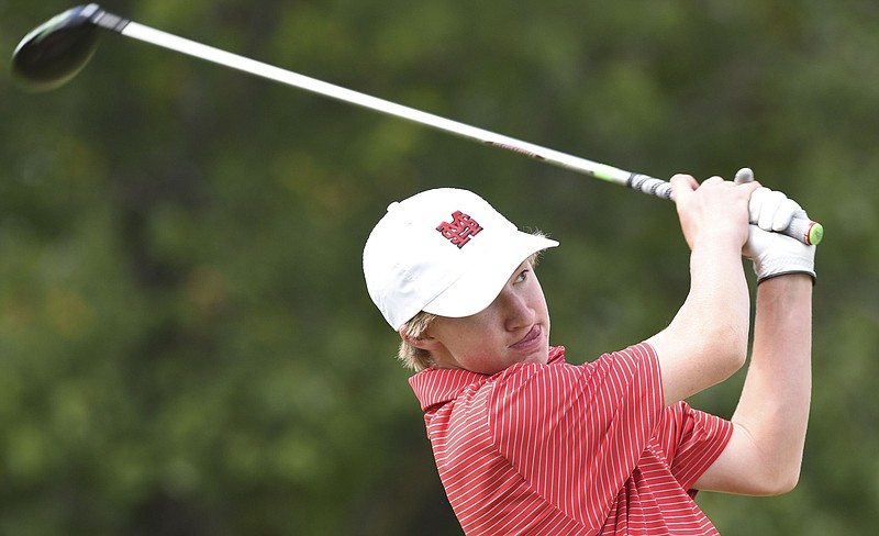 Signal Mountain's Benjamin Burns watches his drive on number 18.  The District 6 Small Golf Tournament was held at Brown Acres Golf Course on September 14, 2017.