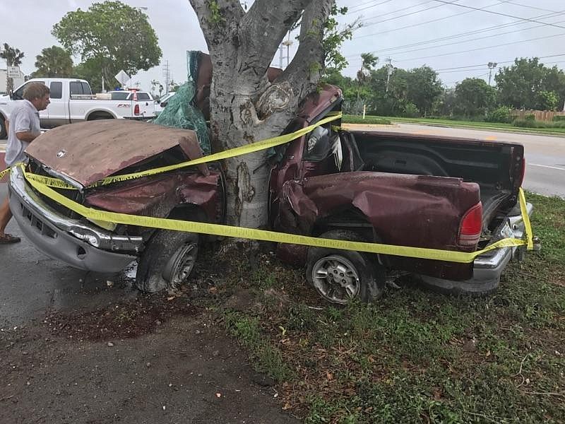 
              This photo provided by the Monroe County Sheriff’s Office shows the wreckage of a truck wrapped around a tree near 98th Street and Highway 1 in Marathon, Fla., in the Florida Keys on Saturday, Sept. 9, 2017. Authorities say they are investigating whether Hurricane Irma's wind and rains contributed to the fatal crash. (Monroe County Sheriff’s Office via AP)
            