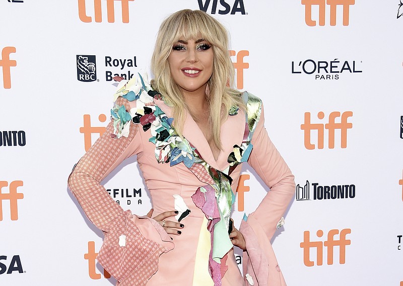 
              FILE - In this sept. 8, 2017 file photo, Lady Gaga attends a premiere for "Gaga: Five Foot Two" at the Toronto International Film Festival in Toronto. Lady Gaga has been hospitalized and forced to pull out of the upcoming Rock in Rio music festival in Brazil, citing “severe physical pain” and posting a photo of what resembles an IV in her arm. (Photo by Evan Agostini/Invision/AP, File)
            