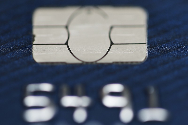 
              FILE - This Wednesday, June 10, 2015, file photo shows a credit card in Philadelphia. Carrying credit card balances from month to month is costly and can derail goals such as saving for a home or building a retirement fund. Knowing how to manage debt can be a challenge. (AP Photo/Matt Rourke, File)
            