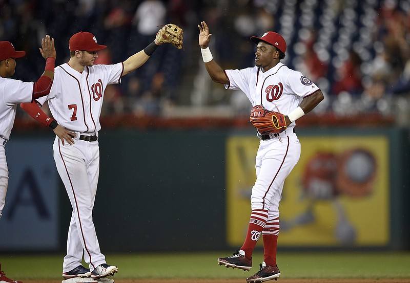Washington Nationals' Victor Robles, right, celebrates with Trea Turner (7) after a baseball game against the Atlanta Braves, Thursday, Sept. 14, 2017, in Washington. The Nationals won 5-2. (AP Photo/Nick Wass)