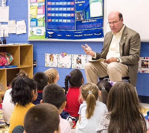 State Rep. Bruce Broadrick reads "Ox-Cart Man, " written by Donald Hall and illustrated by Barbara Cooney, with pre kindergarten students at Dug Gap Elementary Thursday morning. It is Pre-K week in Georgia. Students in Trevor Welch's prekindergarten class also hosted Pre-K coordinator Jae Boyd visiting from the Georgia Department of Early Care and Learning; North Georgia Regional Library Director Linda Floyd; and Karol Radovich, children services coordinator at the Dalton Public Library.