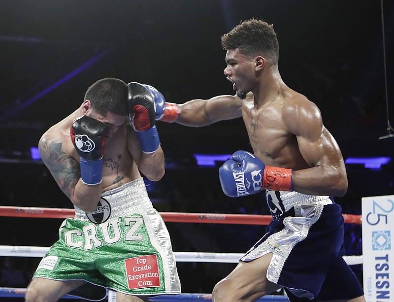 Ryan Martin punches Bryant Cruz during the fifth round of a lightweight boxing match on Saturday, March 18, 2017, in New York. Martin stopped Cruz in the eighth round and fights again tonight in Las Vegas.