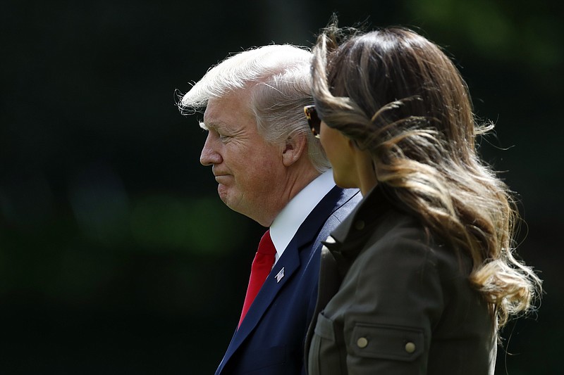 
              President Donald Trump and first lady Melania Trump walk from the Oval Office of the White House in Washington, Friday, Sept. 15, 2017, to Marine One for the short trip to Andrews Air Force Base, Md.. (AP Photo/Carolyn Kaster)
            