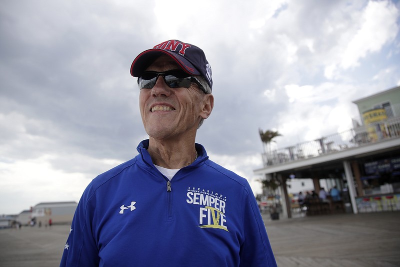 
              In a photo taken Thursday, Sept. 14, 2017, Frank Costello, organizer of the Semper Five charity run in Seaside Heights, N.J., poses for a photograph at the site of the start and finish lines for the race. It's been a year since a pipe bomb blast disrupted the charity race to benefit Marines and marked the start of a two-day reign of terror in the region. But organizers of Saturday's race say its resumption amid tight security shows the region's resiliency. The blast occurred just before the start of last year's race. No one was injured, but the event was canceled. (AP Photo/Julio Cortez)
            