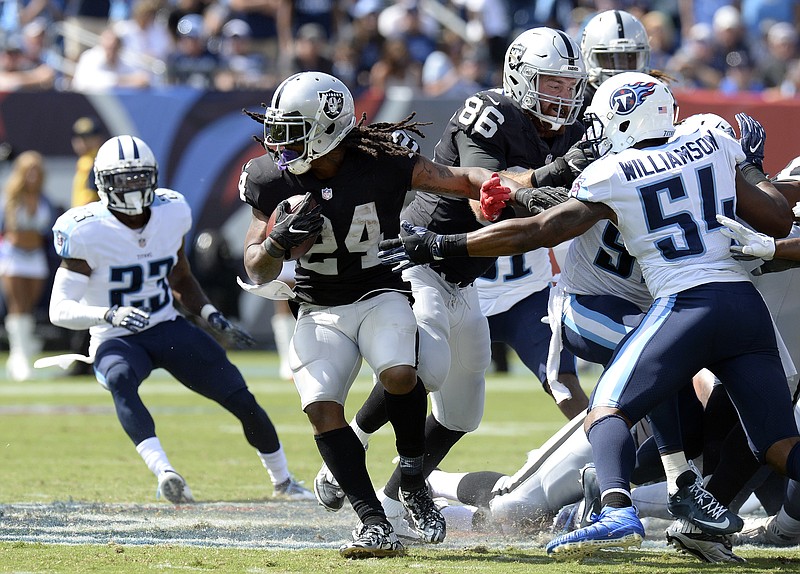 
              FILE - In this Sept. 10, 2017, file photo, Oakland Raiders running back Marshawn Lynch (24) carries the ball against the Tennessee Titans during the second half of an NFL football game in Nashville, Tenn. Carr and the Raiders play their home-opener against the New York Jets on Sunday, Sept. 17. Lynch came out of retirement this offseason for the opportunity to play for the Raiders before the team moves to Las Vegas in 2020. (AP Photo/Mark Zaleski, File)
            