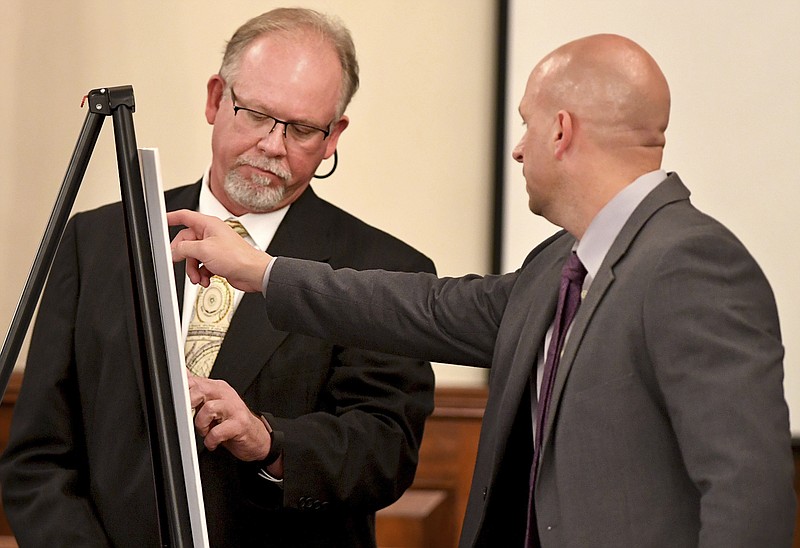 
              Tennessee Bureau of Investigation Special Agent Brent Booth shows Assistant District Attorney Paul Hagerman where items belonging to Holly Bobo were found by former witnesses who testified. Day five of the Holly Bobo murder trial was held Friday, Sept. 15, 2017, in Savannah, Tenn. Zach Adams is charged with felony first-degree murder, especially aggravated kidnapping, aggravated rape of Holly Bobo. (Kenneth Cummings /The Jackson Sun via AP, Pool)
            
