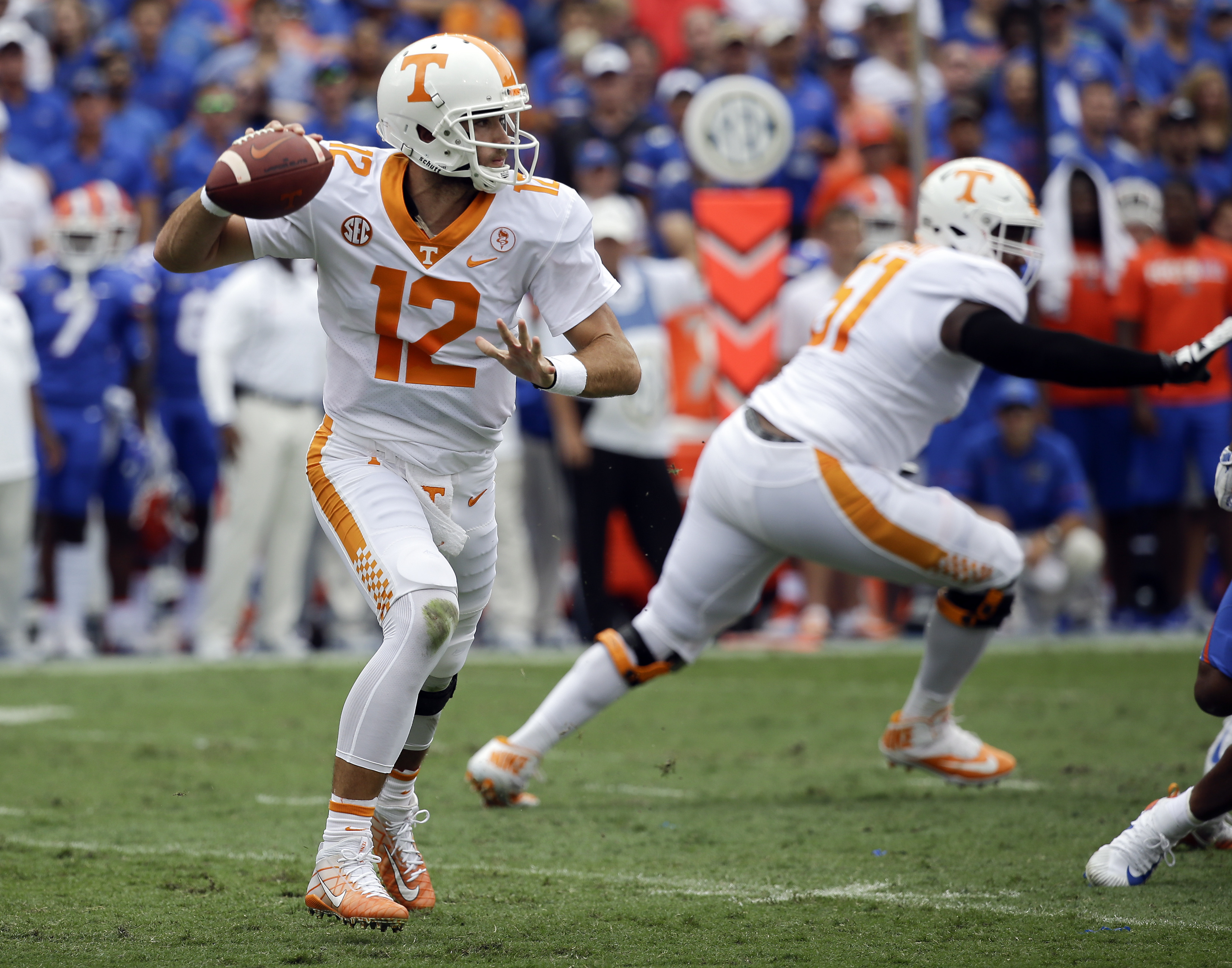 Tennessee quarterback Quinten Dormady (12) looks for a receiver during the first half of an NCAA college football game against Florida, Saturday, Sept. 16, 2017, in Gainesville, Fla. (AP Photo/John Raoux)