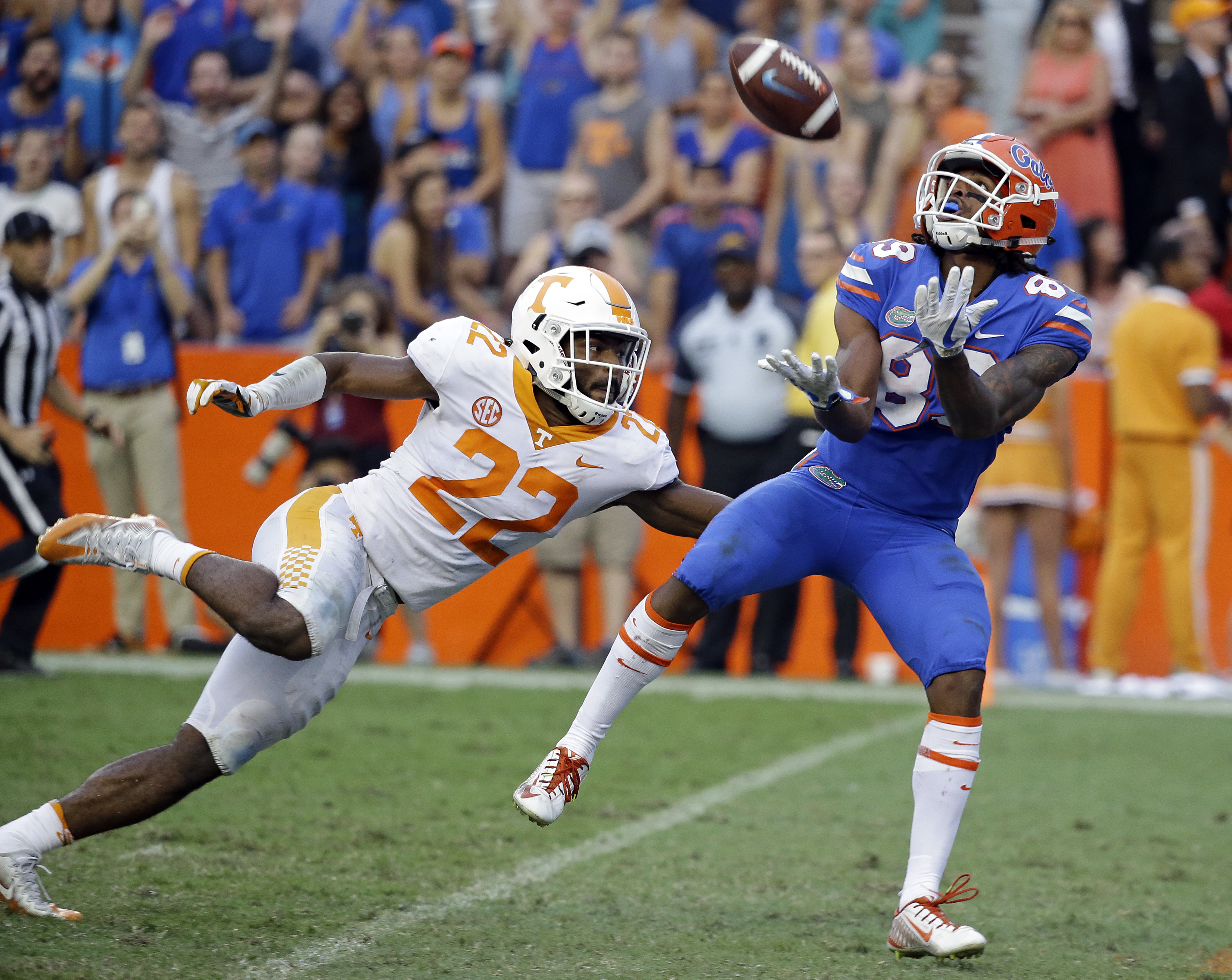 Florida wide receiver Tyrie Cleveland prepares to catch the game-winning 63-yard touchdown pass in front of Tennessee defensive back Micah Abernathy as time expires Saturday afternoon in Gainesville, Fla. Florida won 26-20.