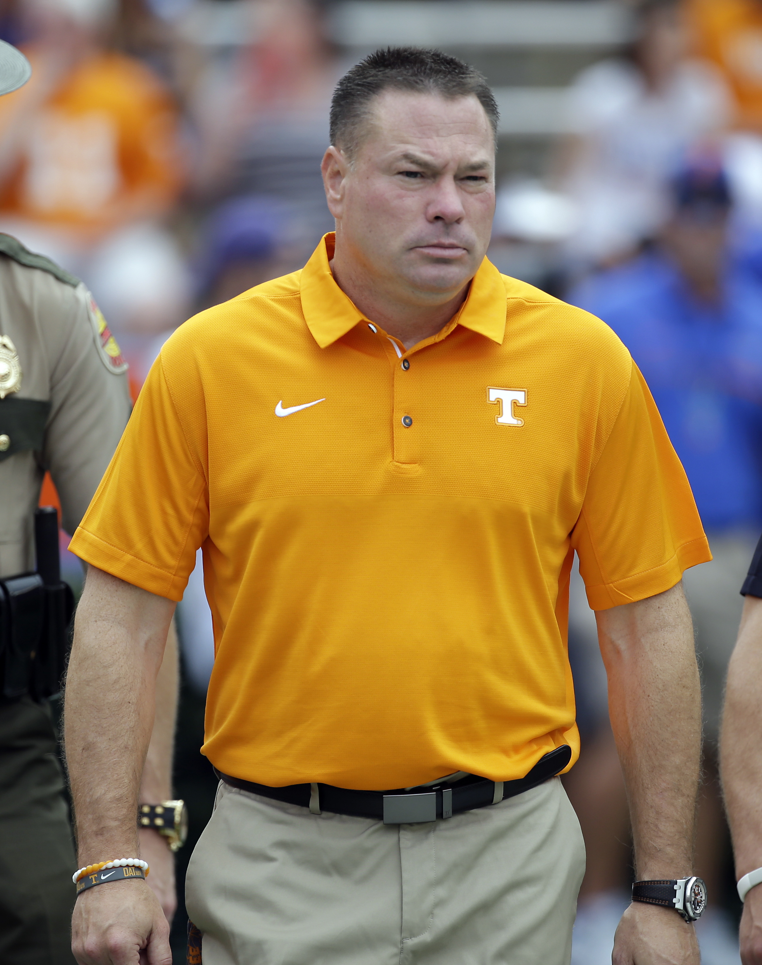 Tennessee head coach Butch Jones takes the field before the first half of an NCAA college football game against Florida, Saturday, Sept. 16, 2017, in Gainesville, Fla. (AP Photo/John Raoux)