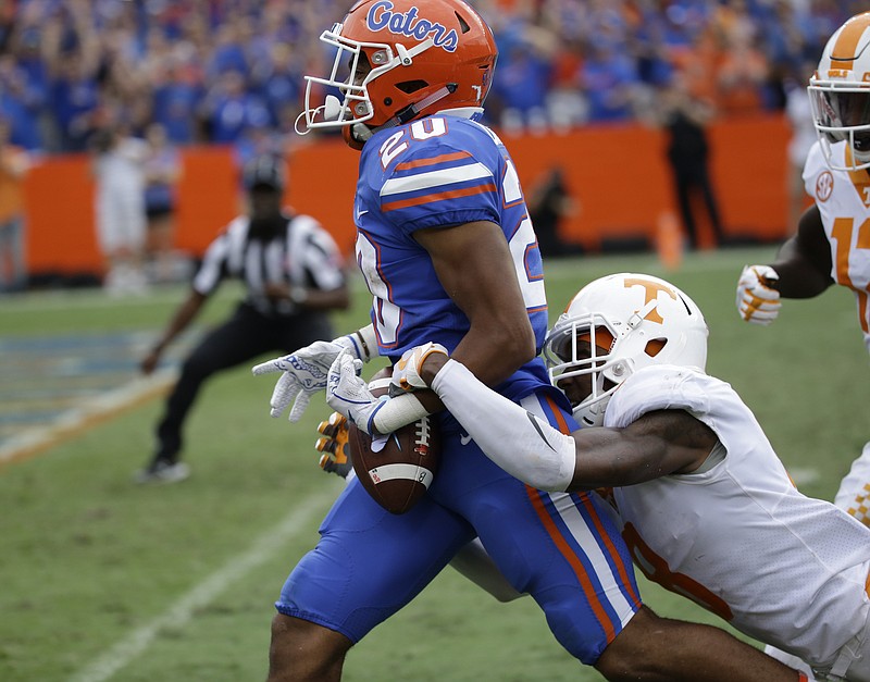 Tennessee cornerback Justin Martin knocks the ball loose from Florida running back Malik Davis on the 2-yard line after Davis had run 72 yards during Saturday's game. The Vols' secondary was thin with Evan Berry and Todd Kelly Jr. out because of injury.