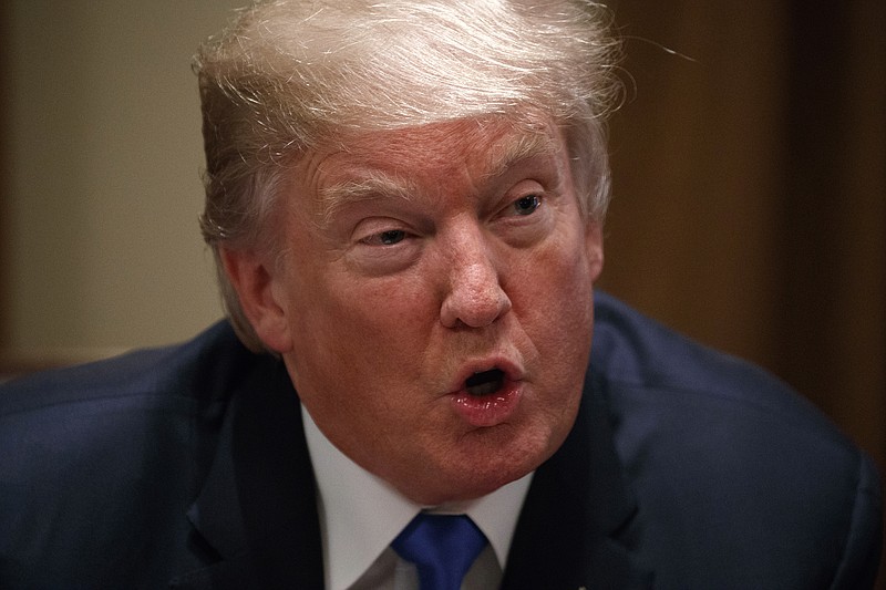 President Donald Trump speaks during a meeting with a bipartisan group of lawmakers in the Cabinet Room of the White House, Wednesday, Sept. 13, 2017, in Washington. (AP Photo/Evan Vucci)