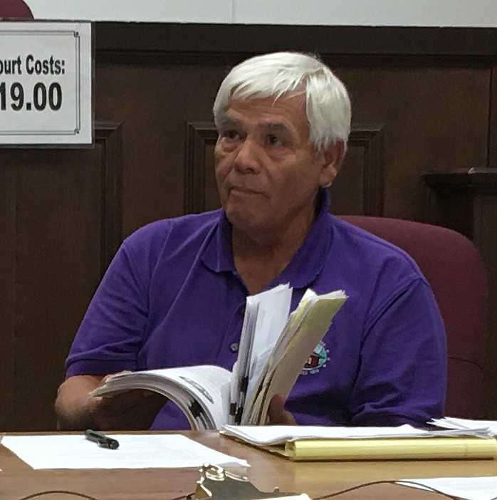 Jasper, Tenn., Mayor Paul Evans displays a folder full of certified letters that he says he's sent out to landowners trying to get them to clean up their properties.