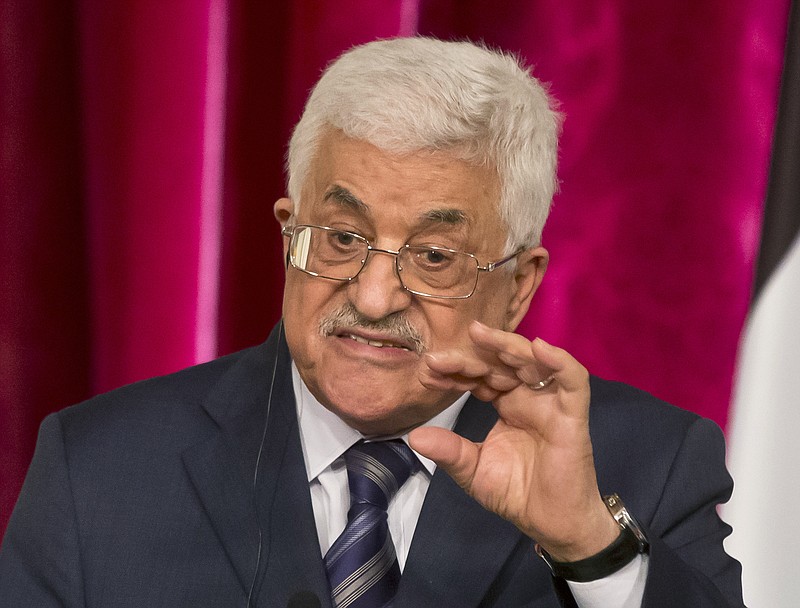 
              FILE - In this Sept. 19, 2014 file photo, Palestinian President Mahmoud Abbas gestures as he speaks during a media conference at the Elysee Palace in Paris. The Hamas militant group on Sunday, Sept. 7, 2017, said it has accepted key conditions demanded by its rival, President Mahmoud Abbas, including nationwide elections in the West Bank and Gaza Strip, to clear the way for a reconciliation deal after a 10-year rift that has left the Palestinians divided between two governments. (AP Photo/Michel Euler, File)
            