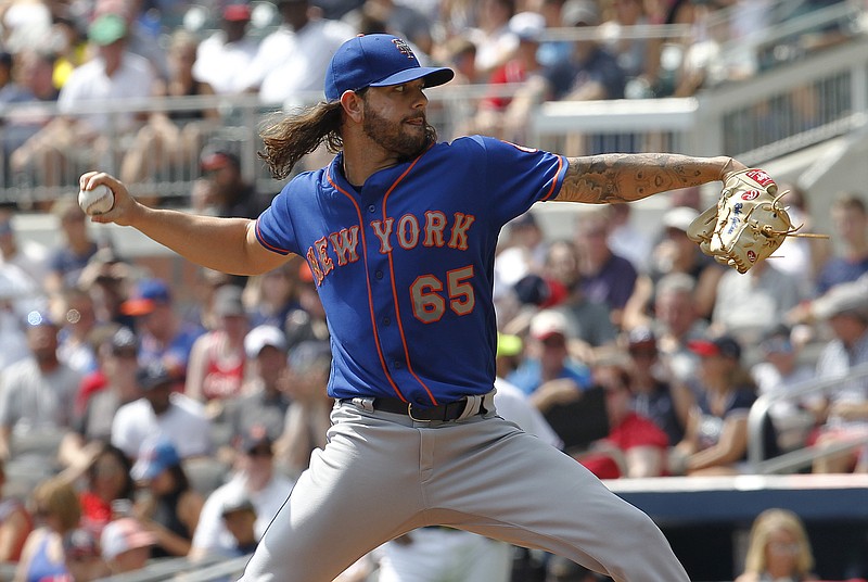 New York Mets starting pitcher Robert Gsellman throws in the first inning of a baseball game against the Atlanta Braves in Atlanta, Sunday, Sept. 17, 2017. (AP Photo/Tami Chappell)