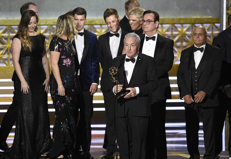 Lorne Michaels and the cast of SNL accept the award for outstanding variety sketch series for "Saturday Night Live" at the 69th Primetime Emmy Awards on Sunday, Sept. 17, 2017, at the Microsoft Theater in Los Angeles. (Photo by Chris Pizzello/Invision/AP)