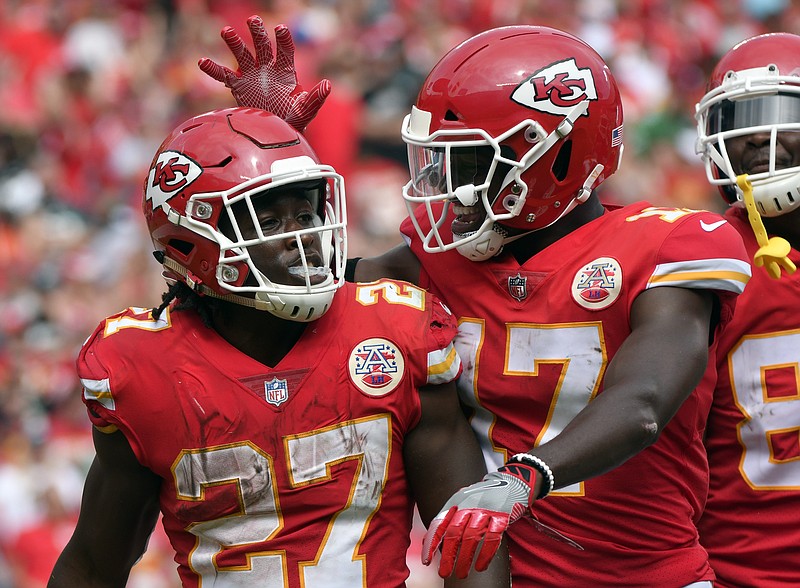 
              Kansas City Chiefs running back Kareem Hunt (27) is congratulated by wide receiver Chris Conley (17) after scoring a touchdown against the Philadelphia Eagles during the second half of an NFL football game in Kansas City, Mo., Sunday, Sept. 17, 2017. (AP Photo/Ed Zurga)
            