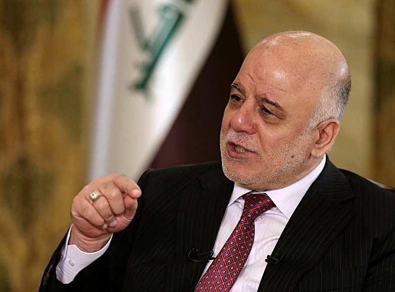 
              Iraq's Prime Minister Haider al-Abadi speaks during an interview with The Associated Press in Baghdad, Iraq, Saturday, Sept. 16, 2017. Al-Abadi says he is prepared to intervene militarily if the Kurdish region's planned referendum results in violence. (AP Photo/Karim Kadim)
            