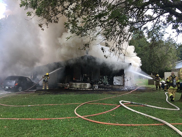 Firefighters work to extinguish a house fire on the 1200 block of Judys Lane on Sunday, Sept. 17, 2017. (Photo by Capt. David Thompson)