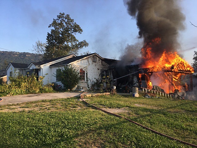 Firefighters work to extinguish a house fire on the 3200 block of Beech Street on Sunday, Sept. 17, 2017. (Photo by Capt. David Thompson)