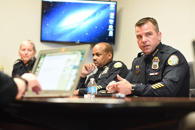 Chattanooga Police Chief David Roddy, right, talks to the Times Free Press editorial board. Assistant Chief's Danna Vaughn, left, and Edwin McPherson listen.