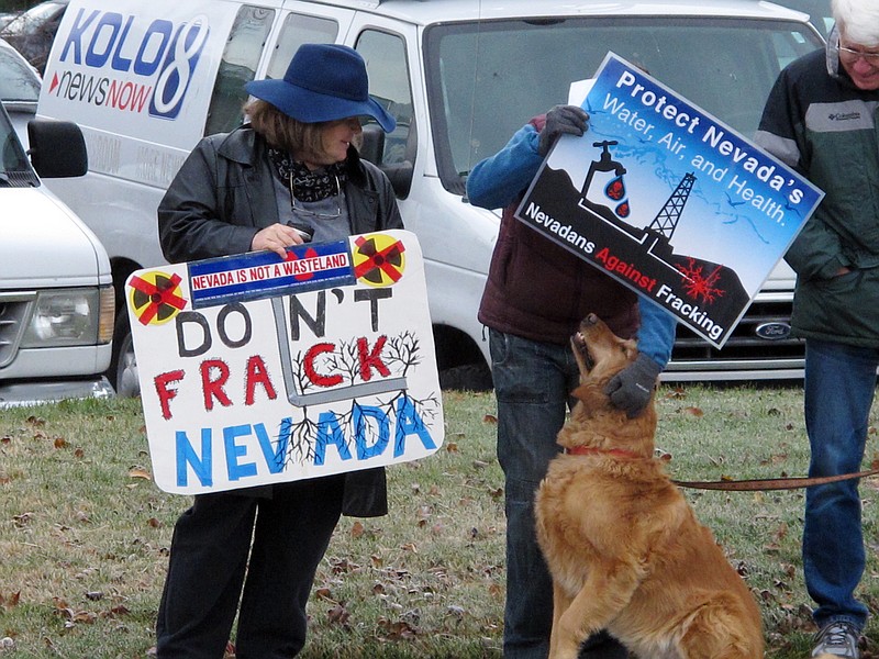
              FILE - In this Dec. 9, 2014 file photo, anti-fracking protesters rally outside the U.S. Bureau of Land Management (BLM) in Reno, Nev., during the auction of oil and gas leases for energy exploration that critics say poses a threat to fish, wildlife and groundwater. Environmentalists filed an anti-fracking lawsuit in Nevada to block an effort to expand oil and gas drilling on federal land. Two national conservation groups say the Bureau of Land Management is reversing course from policies it enacted in the final weeks of the Obama administration. (AP Photo/Scott Sonner, File)
            