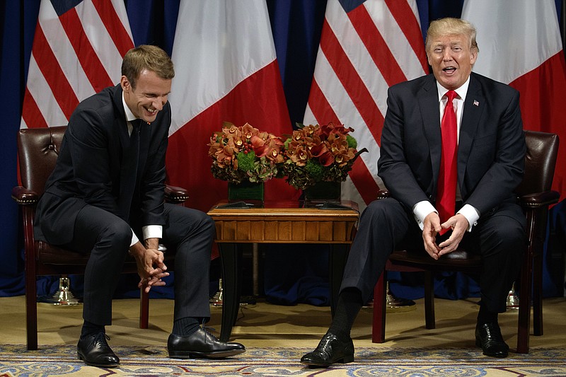 
              President Donald Trump jokes with French President Emmanuel Macron during a meeting at the Palace Hotel during the United Nations General Assembly, Monday, Sept. 18, 2017, in New York. (AP Photo/Evan Vucci)
            