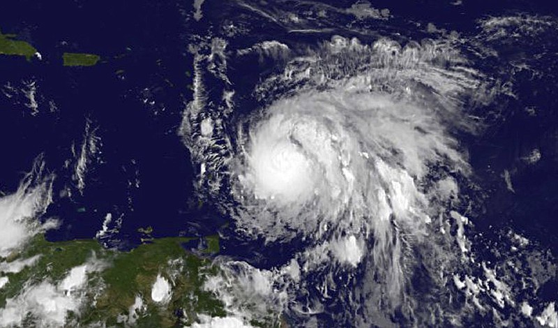 
              This Sunday, Sept. 17, 2017, GOES East satellite image provided by NASA taken at 7:45 p.m EDT, shows Hurricane Maria as it approaches the Lesser Antilles. Maria swiftly grew into a hurricane Sunday, and forecasters said it was expected to become much stronger over the coming hours following a path that would take it near many of the islands wrecked by Hurricane Irma and then on toward Puerto Rico, the Dominican Republic and Haiti. (NASA via AP)
            