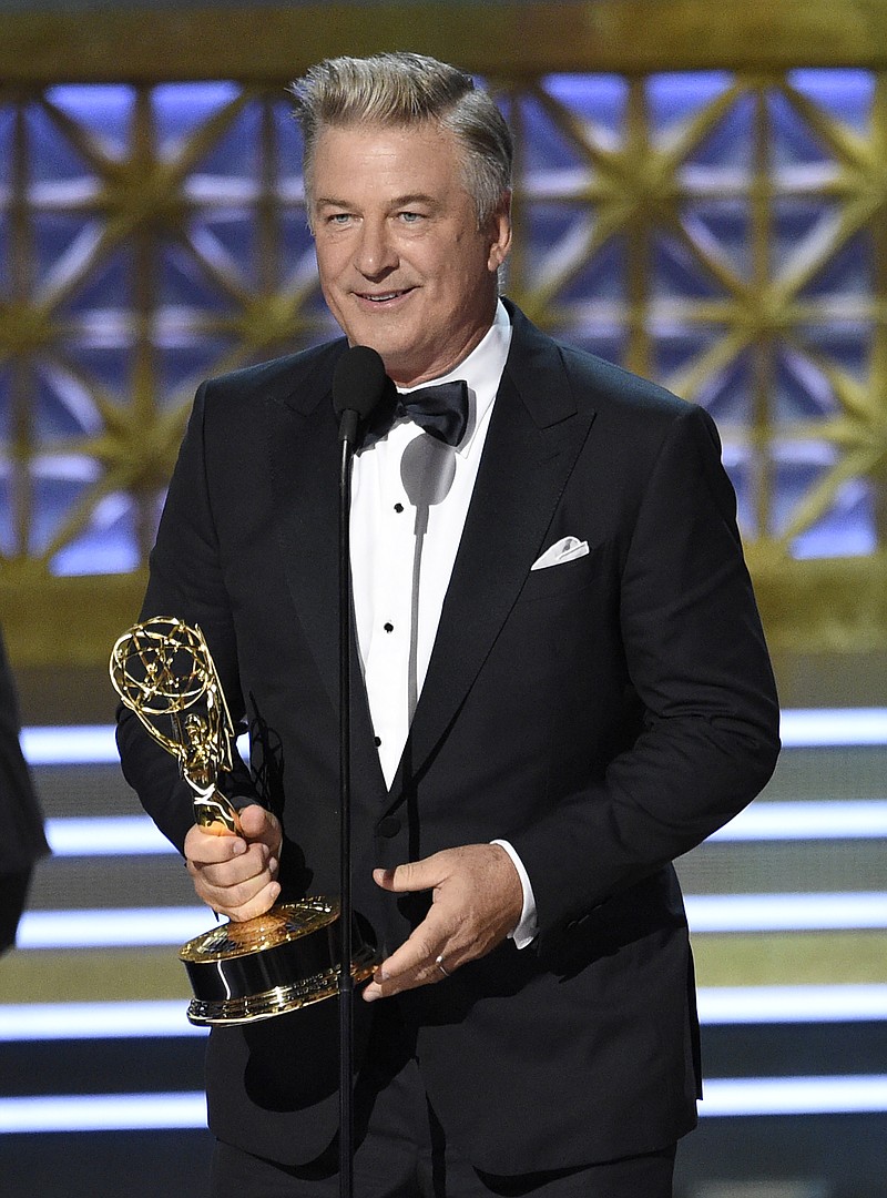 
              Alec Baldwin accepts the award for outstanding supporting actor in a comedy series for "Saturday Night Live" at the 69th Primetime Emmy Awards on Sunday, Sept. 17, 2017, at the Microsoft Theater in Los Angeles. (Photo by Chris Pizzello/Invision/AP)
            