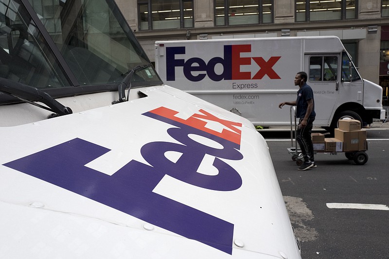 
              In this Tuesday, Aug. 22, 2017, photo, FedEx trucks are parked in New York. FedEx Corp. reports earnings, Tuesday, Sept. 19, 2017. (AP Photo/Mark Lennihan)
            