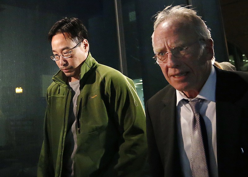 
              FILE - In this Friday, Dec. 19, 2014, file photo the former supervisory pharmacist for the New England Compounding Center, Glenn Chin, left, leaves the federal courthouse in Boston with his attorney Stephen Weymouth after a hearing to announce conditions of his bail and release. Chin who was the supervisory pharmacist at the now-closed New England Compounding Center in Framingham is heading to trial with opening arguments in the case are expected on Tuesday, Sept. 19, 2017. He faces up to life in prison if convicted of all counts of second-degree murder under federal racketeering law. (AP Photo/Elise Amendola, File)
            