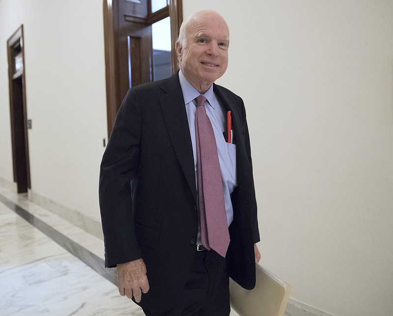 
              FILE - In this Sept. 5, 2017, file photo, Sen. John McCain, R-Ariz., walks from his Senate office as Congress returns from the August recess in Washington. The Senate has overwhelmingly approved a sweeping policy bill that would pump $700 billion into the military, putting the U.S. armed forces on track for a budget greater than at any time during the decade-plus wars in Iraq and Afghanistan. (AP Photo/J. Scott Applewhite, File)
            