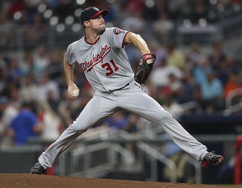 Washington Nationals starting pitcher Max Scherzer (31) works in the first inning of a baseball game against the Atlanta Braves Tuesday, Sept. 19, 2017, in Atlanta. (AP Photo/John Bazemore)