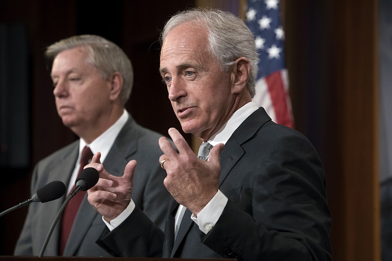 
              FILE- In this Aug. 3, 2017, file photo, Senate Foreign Relations Committee Chairman Sen. Bob Corker, R-Tenn., joined at left by Sen. Lindsey Graham, R-S.C., speaks with reporters after his panel approved the "Taylor Force Act," at the Capitol in Washington. President Donald Trump is encouraging Corker to run for another term, according to two people familiar with a meeting between the two Republicans at the White House last week. (AP Photo/J. Scott Applewhite, File)
            