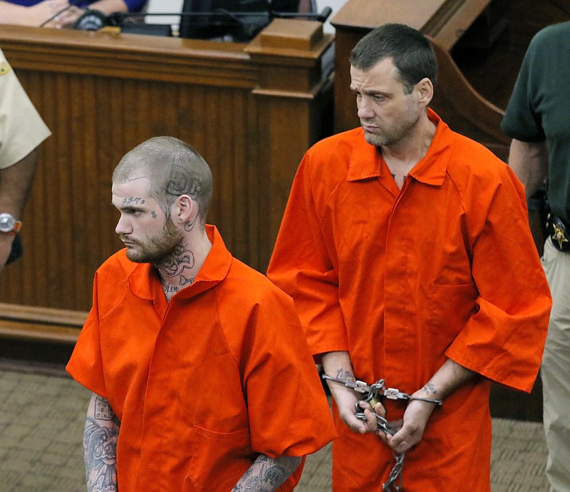 
              FILE - In this June 21, 2017, file photo, Ricky Dubose, left, and Donnie Russell Rowe enter the Putnam County courthouse in Eatonton, Ga. The two inmates, accused of killing their guards on a Georgia prison bus three months ago, were indicted Tuesday, Sept. 19, 2017, on multiple charges including murder and the state plans to seek the death penalty. (Bob Andres/Atlanta Journal-Constitution via AP, Pool)
            