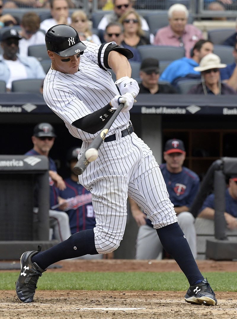 
              New York Yankees' Aaron Judge hits a two-run home run during the third inning of a baseball game against the Minnesota Twins Wednesday, Sept. 20, 2017, at Yankee Stadium in New York. (AP Photo/Bill Kostroun)
            