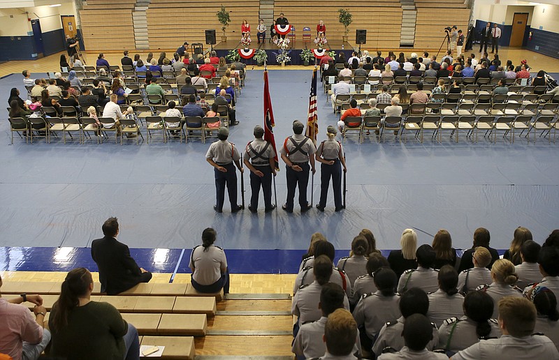 United States District Judge Harry S. Mattice Jr., top, welcomes the crowd before the presentation of the colors during a Naturalization Ceremony in Susan Ingram Thurman Gymnasium at Red Bank High School on Tuesday, Sept. 19, in Chattanooga, Tenn. About 50 people took the Oath of Allegiance to become American citizens during the ceremony. It was one of many ceremonies being held across the county fro Constitution Day and Citizenship Day.