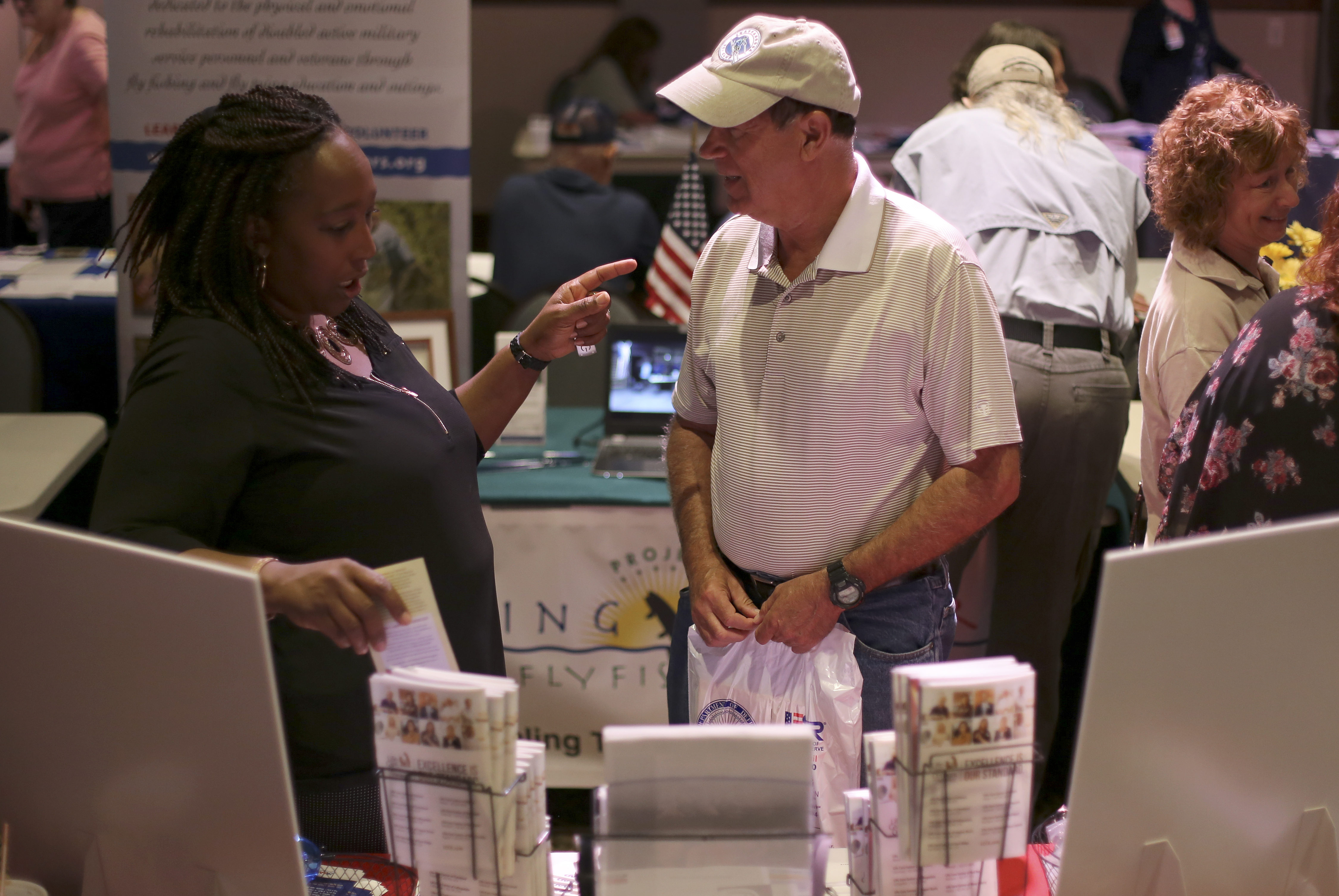 Dave Drumm, right, speaks with Christin McWhorter, with the Southeast Tennessee Area Agency on Aging and Disabily, during the "Joint Operation" event at the Museum Center at 5ive Points on Wednesday, Sept. 20, in Cleveland, Tenn. The free event was open to all Tennessee veterans and their families and featured more than 45 agencies and organizations with information on a number of resources, including VA claim assistance, vocational rehabilitation, education, employment, mental health, housing, legal assistance and more.