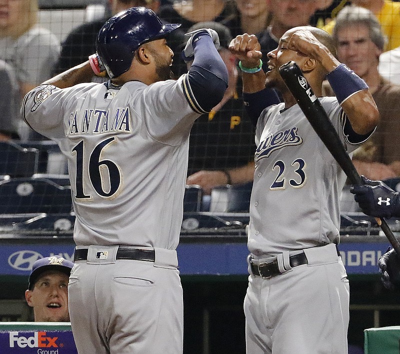 
              Milwaukee Brewers' Domingo Santana (16) celebrates with Keon Broxton (23) after hitting a solo home run off Pittsburgh Pirates starting pitcher Steven Brault in the third inning of a baseball game, Wednesday, Sept. 20, 2017 in Pittsburgh. (AP Photo/Gene J. Puskar)
            