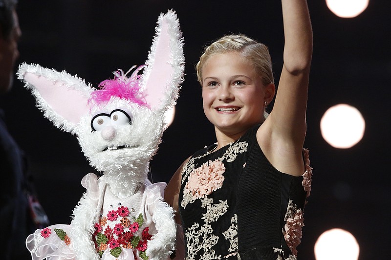 
              This Wednesday, Sept. 20, 2017 photo shows Darci Lynne Farmer on "America's Got Talent" in Los Angeles. The 12-year-old girl is getting a $1 million prize and her own Las Vegas show after taking the “America’s Got Talent” crown on the season 12 finale of the NBC reality competition Wednesday. (Trae Patton/NBC via AP)
            