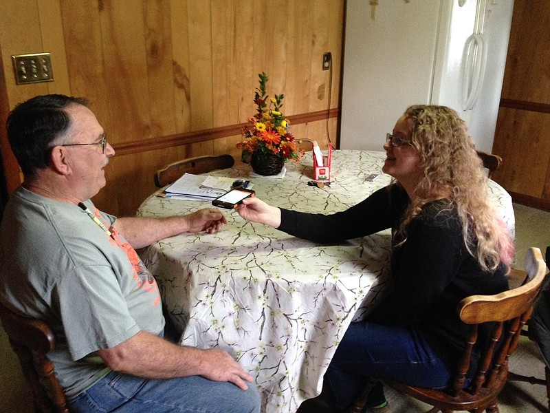 
              FILE - In this Nov. 27, 2015, file photo, Rhiannon Leonard interviews her boss, Gary Himes in Weverton, Md., for StoryCorps' Great Thanksgiving Listen oral history project. The Great Thanksgiving Listen will be held for a third year in 2017. The event calls for high school students to record a conversation with an elder over the holiday weekend using the StoryCorps app. (AP Photo/David Dishneau, File)
            
